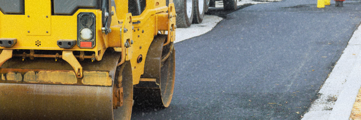 An asphalte truck leveling the surface